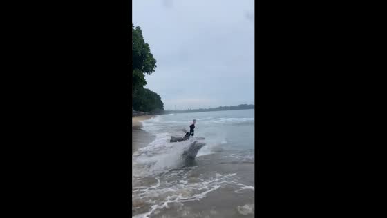 Beachgoer gets knocked down while trying to control water