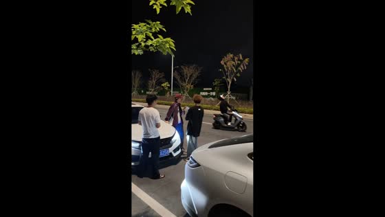 Singing scooter rider surprises bystanders on Shuidong Street in Guangdong, China