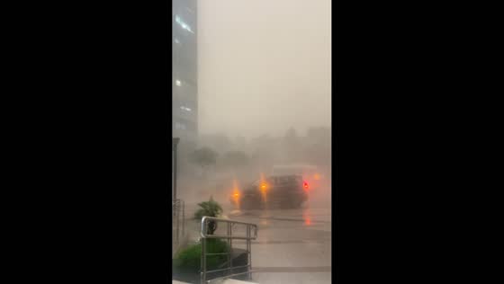 Strong winds and heavy rain reduce visibility in Noida, India