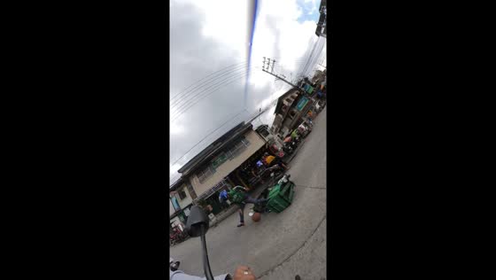 Delivery rider falls after collision with rolling basketball