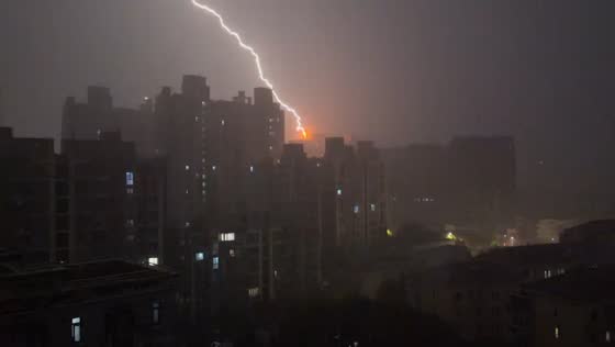 Lightning strikes building during thunderstorm in Shanghai, China