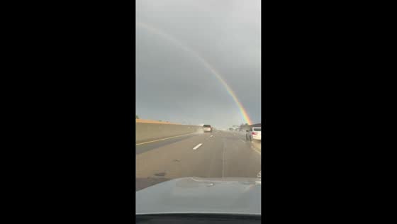 Full rainbow arches across the sky in Anaheim, California, USA