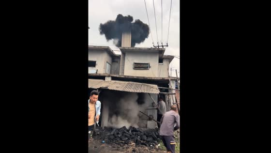 Chimney cleaning creates spectacular smoke cloud in China