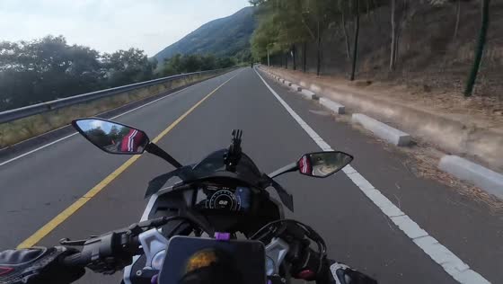 Motorcycle rider crashes after failing to navigate a curve on mountain road in Shandong, China
