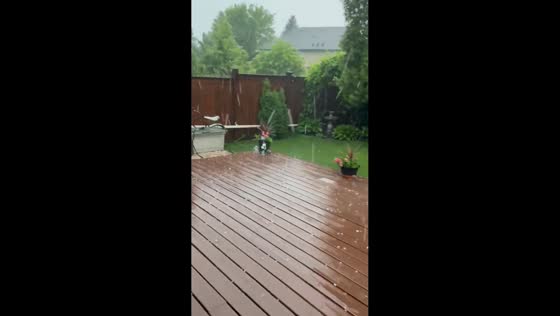 Severe hailstorm pelts deck during storm in Winnipeg, Manitoba, Canada