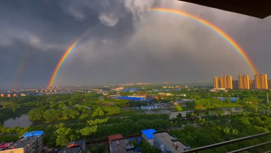 Massive rainbow appears beneath storm clouds in Hebei, China