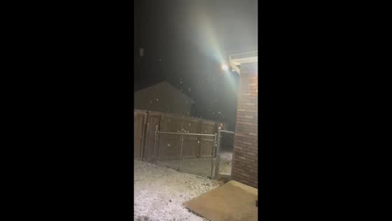 Continuous snowfall blankets neighborhood in Clarksville, USA