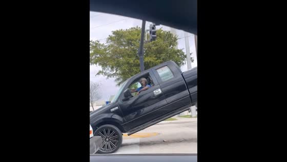 Pickup truck towed with driver inside in Lauderdale Lakes, Florida, USA