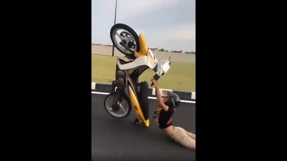 A man's motorcycle stunt goes wrong in Malaysia