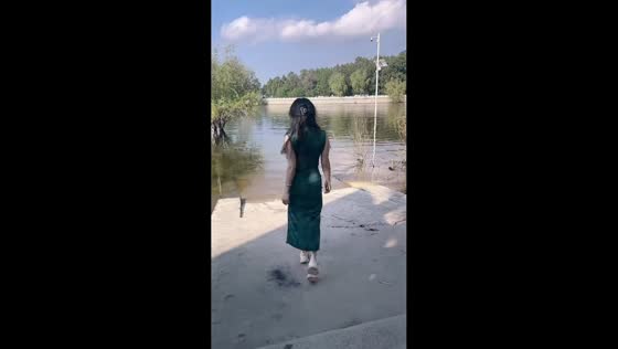 Woman slips near lakeside pavement in Henan, China