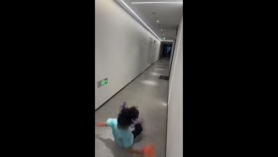 Girl slips while chasing bubbles in Shandong, China