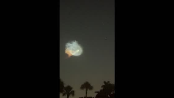 SpaceX rocket launch creates glowing cloud across the night sky in Naples, USA