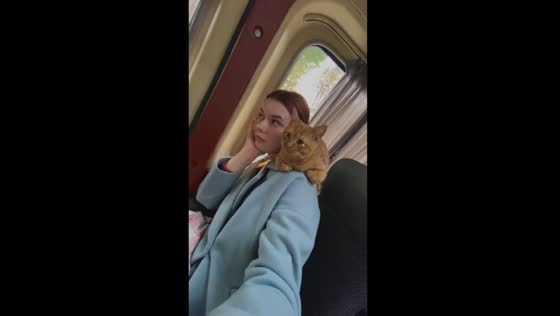 Belarusian beauty: Rita and 6-month-old cat Chipsik's adorable bus ride!