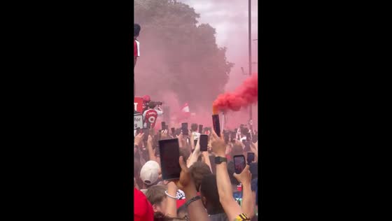 Arsenal fans celebrate during trophy parade in London, UK