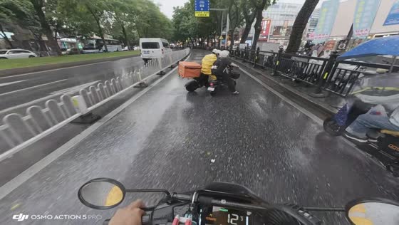Two e-bike riders confront each other on road in Guangdong, China