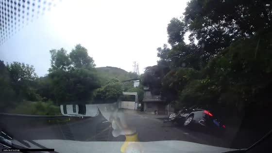 Truck collision sends car into roadside canal in Sichuan, China