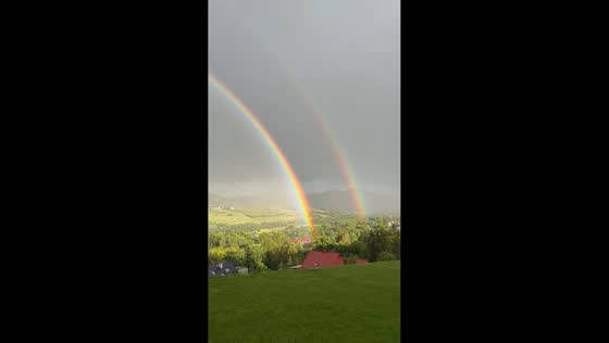 Double rainbow appears beneath stormy skies in Krakow, Poland