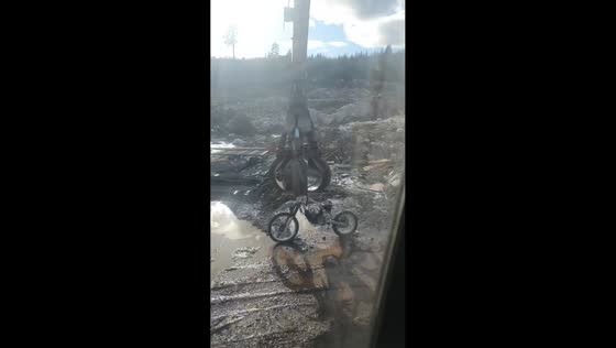 Crane plays with discarded motorcycle before disposing of it in Borlänge, Sweden