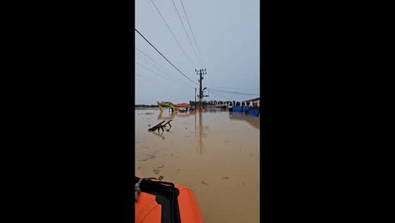 Floods submerge cars and excavators nearly sunk in Medan, Sumatra Utara, Indonesia