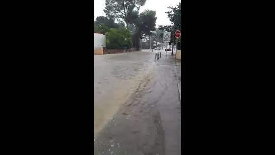 Muddy floodwaters sweep through streets during intense storm in Montpellier, France