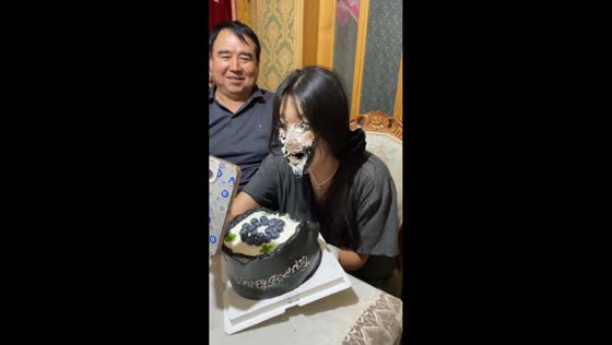 Father playfully smashes cake on daughter’s front in Xinjiang, China