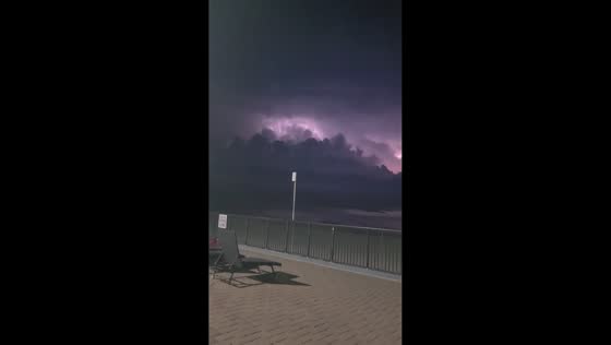 Powerful lightning storm illuminates waterfront in Garden City, USA