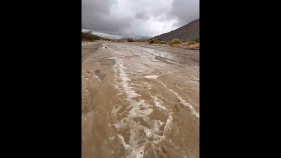 Minor flash flooding rushes through Coyote Canyon in California, USA