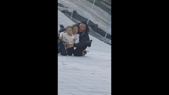 Family snow gliding ends in funny fall in Hubei, China