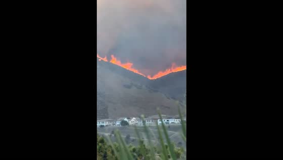 Norte Fire burns along mountain ridge as wildfire threatens homes in California, USA