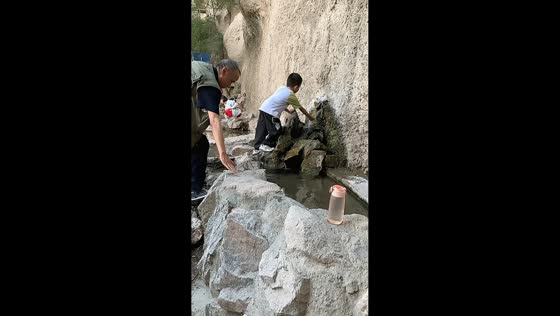 Woman prevents elderly man from falling at spring in Gansu, China