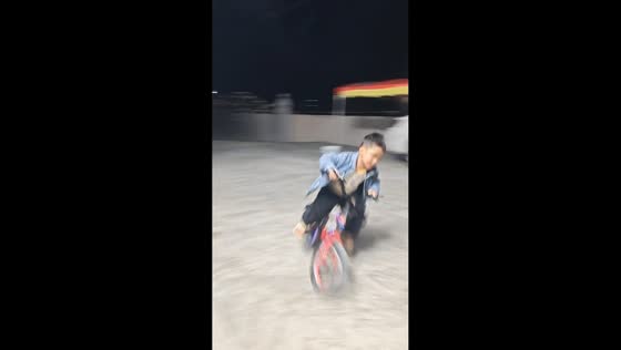 Young boy shows off biking skills in Guangdong, China