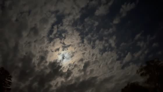 Moon peeking through clouds in Gray, Kentucky, USA