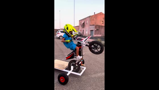 Child performs first supported wheelie on dirt bike in Sardegna, Italy