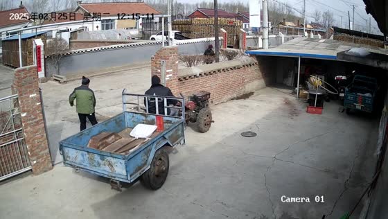 Man carefully parks a two-wheel tractor with utility trailer in Beijing, China
