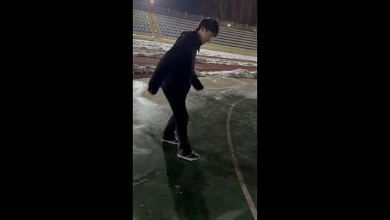 Man slips and falls on frozen ground in Jiangsu, China
