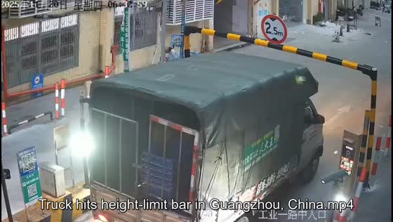 Truck hits height-limit bar in Guangzhou, China