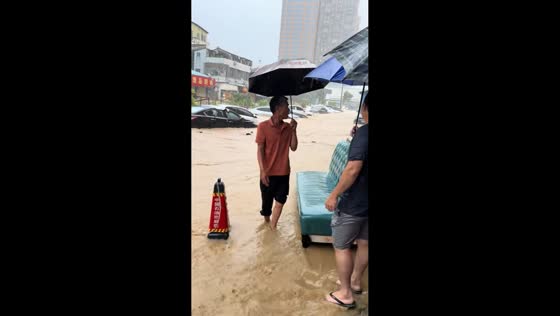 Severe flooding submerges parked vehicles and strands people in Guangdong, China