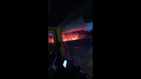 Wildfires blaze through forest fanned by heatwave and strong winds in Muxía, Spain