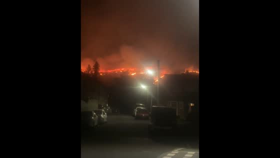 Wildfire burns mountainside near homes in Rhondda Cynon Taf, Wales, UK