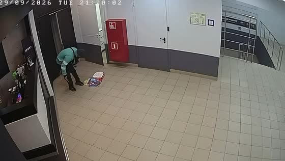 Courier drops pizza while distracted by phone during delivery in Moscow, Russia