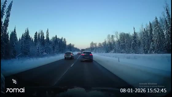 Car crashes into ditch after failed overtake on snowy road in Leningrad, Russia