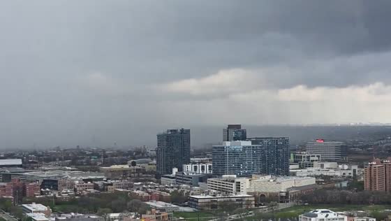 Dark rain band approaches downtown Chicago amid storm system in Illinois, USA