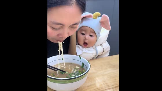 Seven-month-old child opens mouth for food in Jiangsu