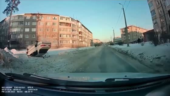 Car overturns on snow-covered street in Angarsk, Russia