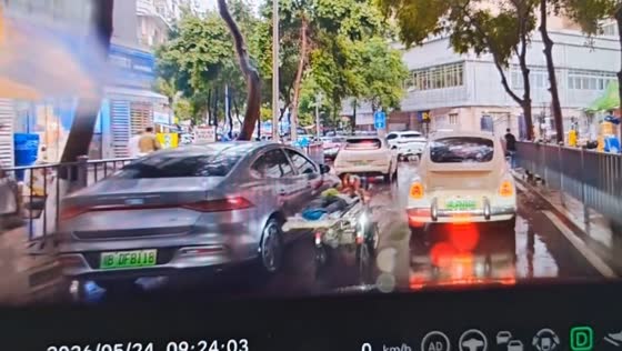 Man rides reclining hospital bed through traffic in Sichuan, China