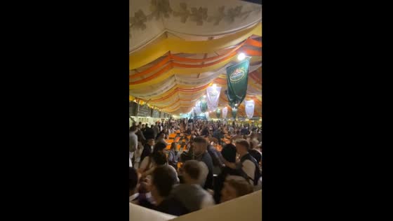 Young people storm beer tent at Bavarian folk festival