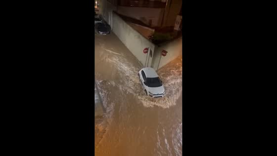 Vehicles submerged by powerful street flooding in Tarragona, Spain