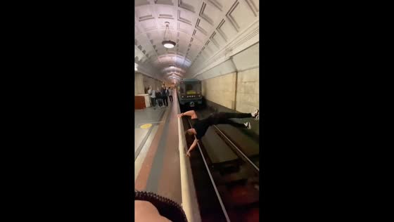 Unexpected calisthenics performance on underground train platform in Moscow, Russia