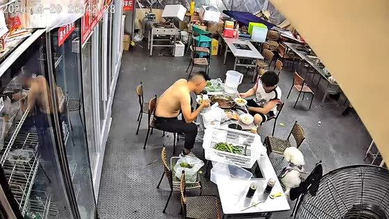 Refrigerator topples onto table inside restaurant in Shaanxi, China