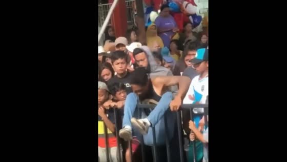 Fail! Man tries to climb the fence and gets stuck!